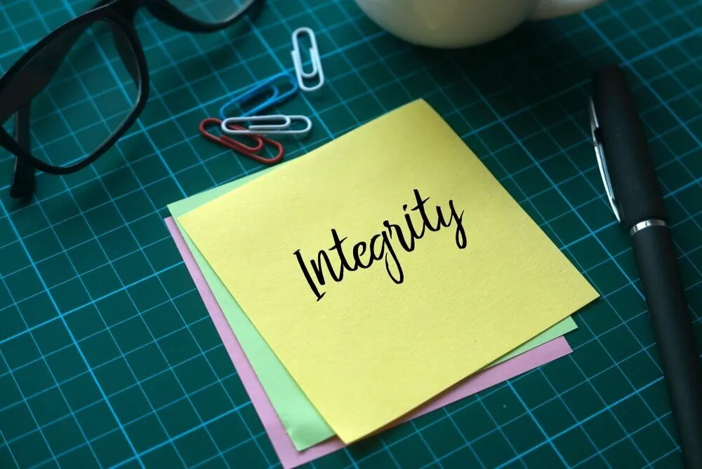 selective-focus-of-a-cup-of-coffee-paper-clips-glasses-and-memo-notes-written-with-integrity-on-green_t20_gLaJKG.jpg